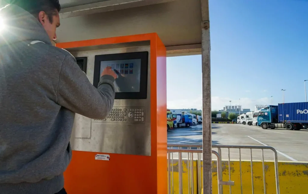 Person using the Peripass self check-in kiosk at Alpro