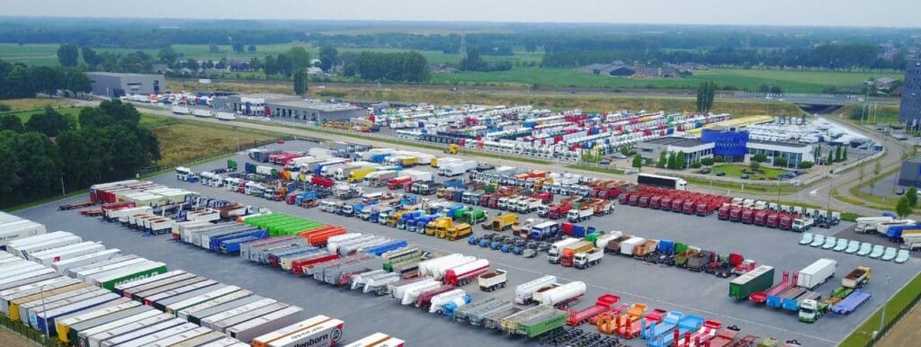 Large parking lot with trucks and trailers