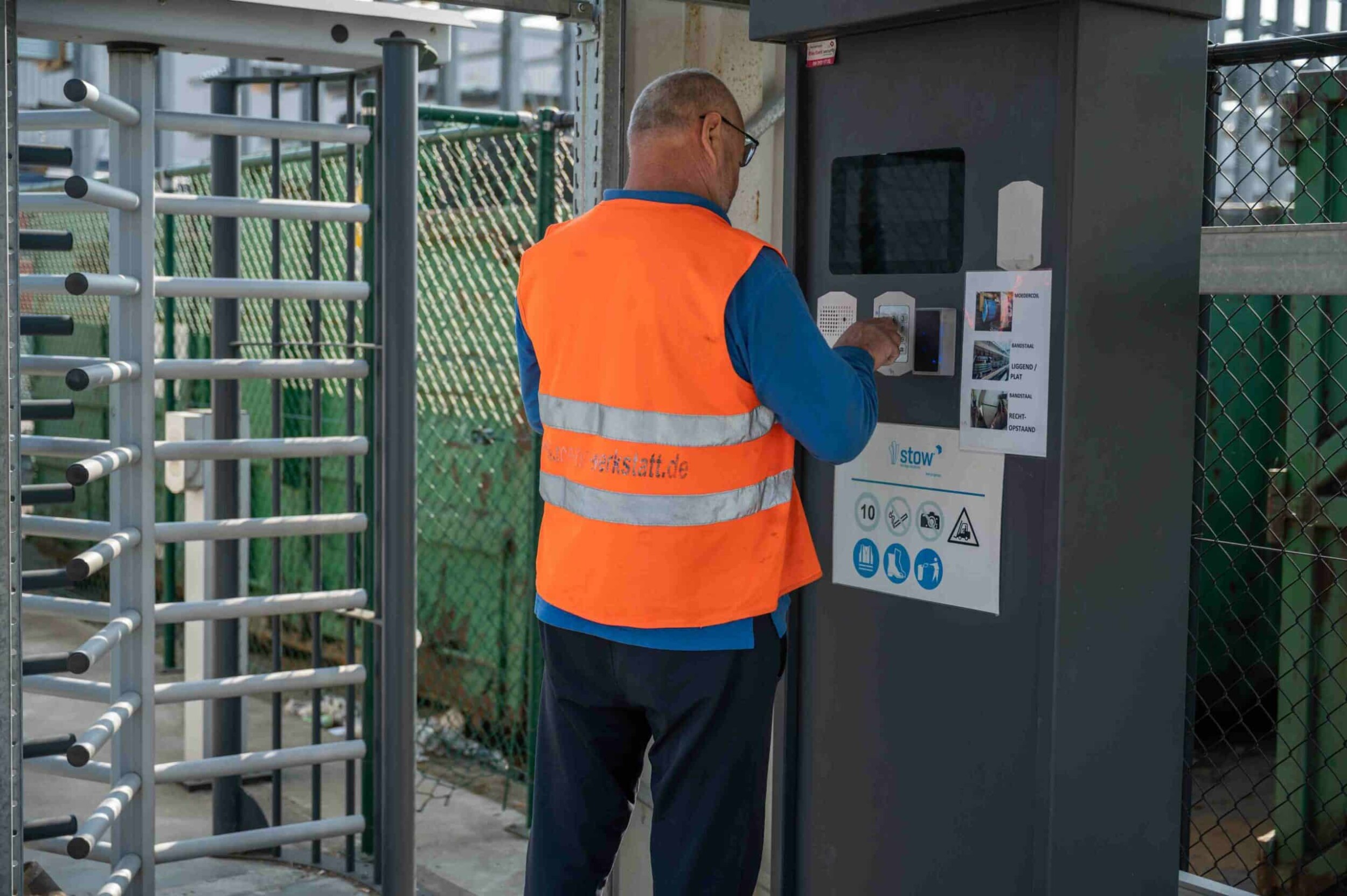 Truck driver checking in with the Peripass kiosk