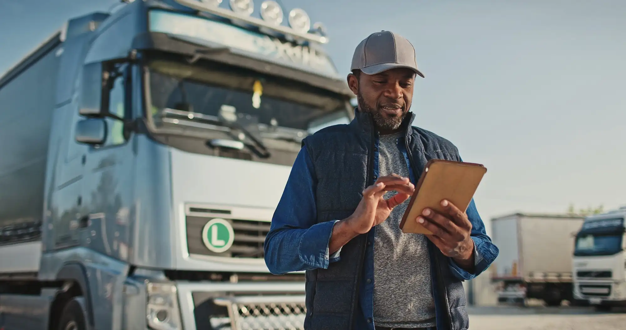 Truck driver checking his mobile device